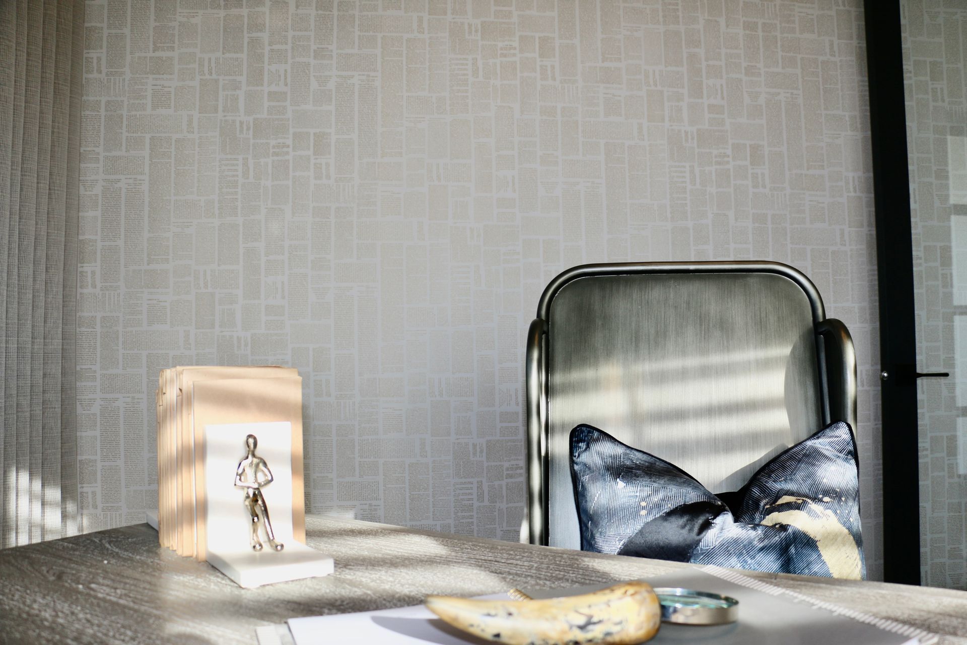 There is a chair and a table in the room.