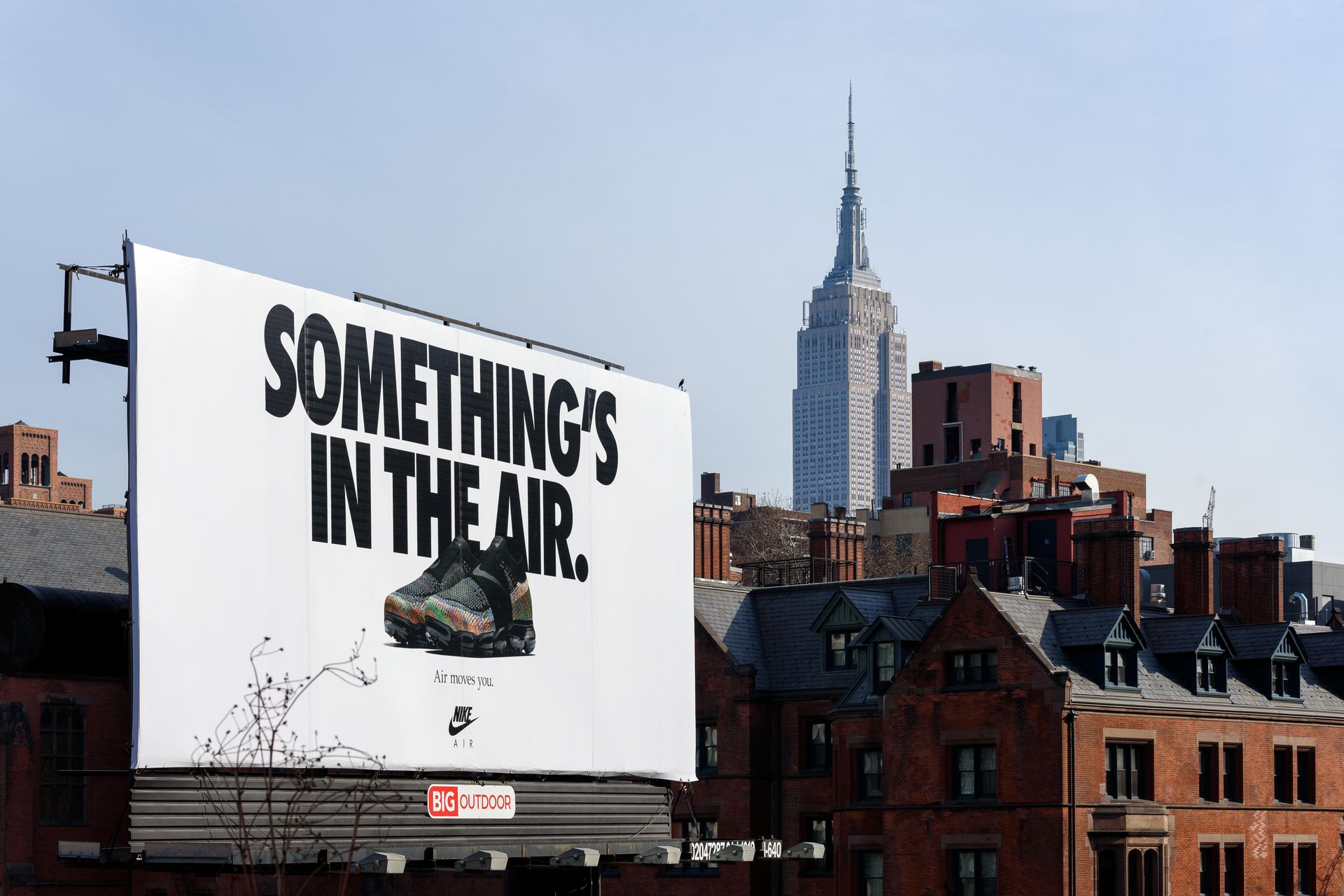 A billboard that says something 's in the air