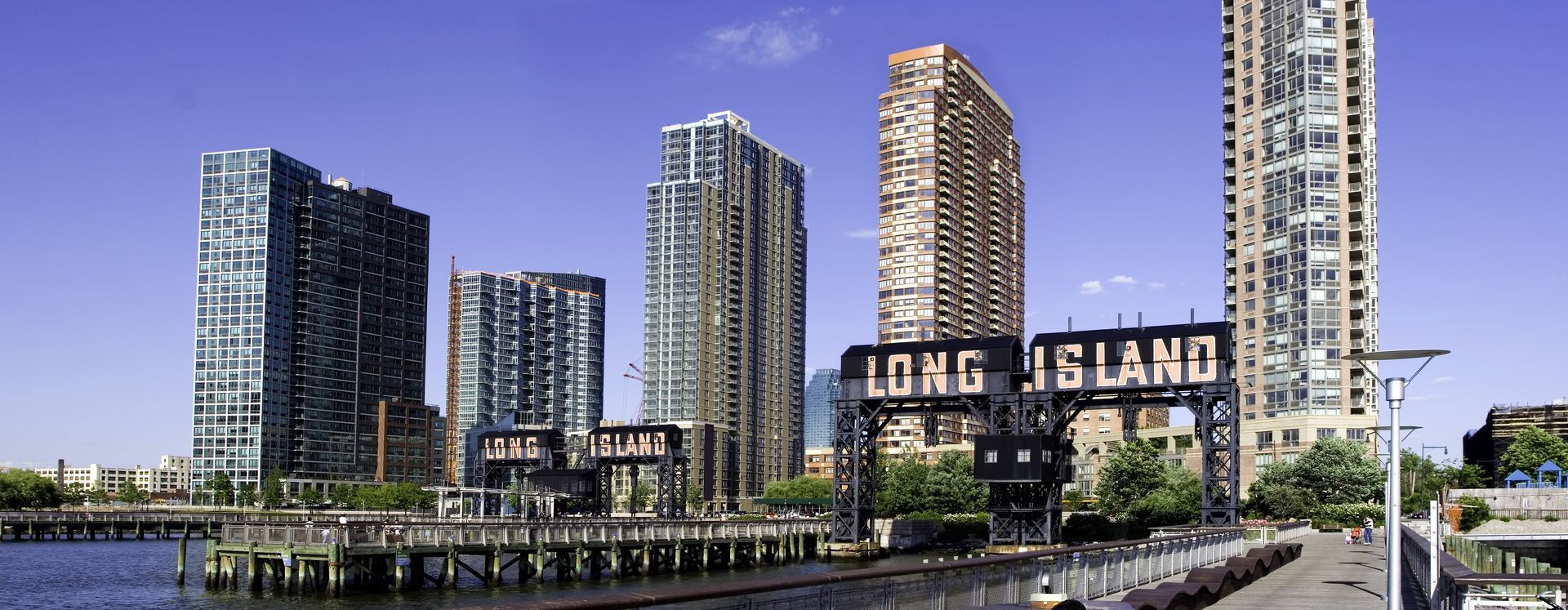 View of Long Island City skyline with water in the foreground and a