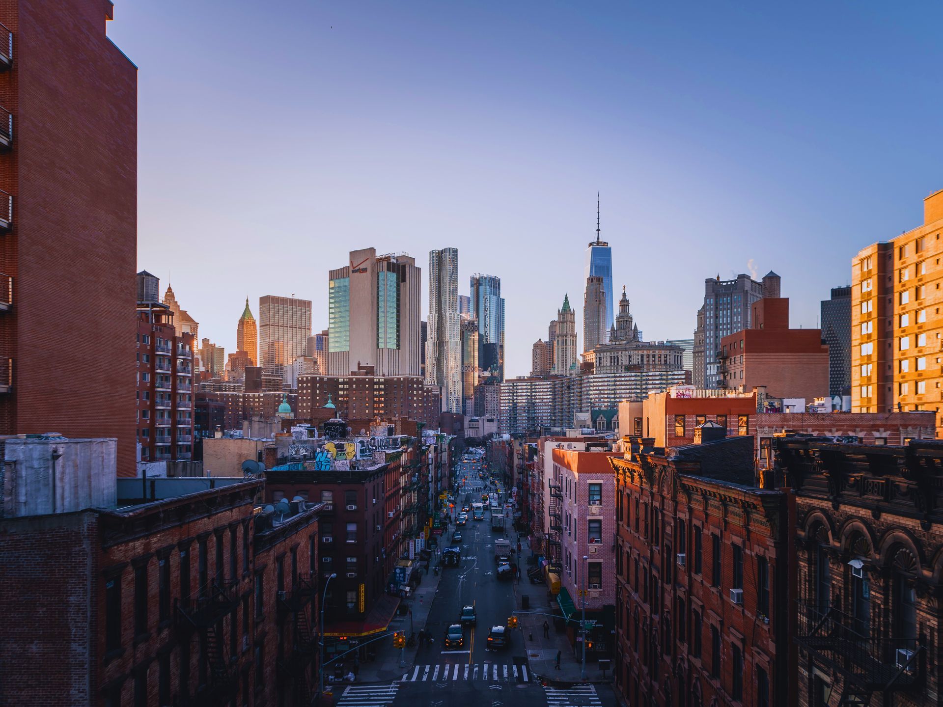 An aerial view of a city with a skyline in the background.