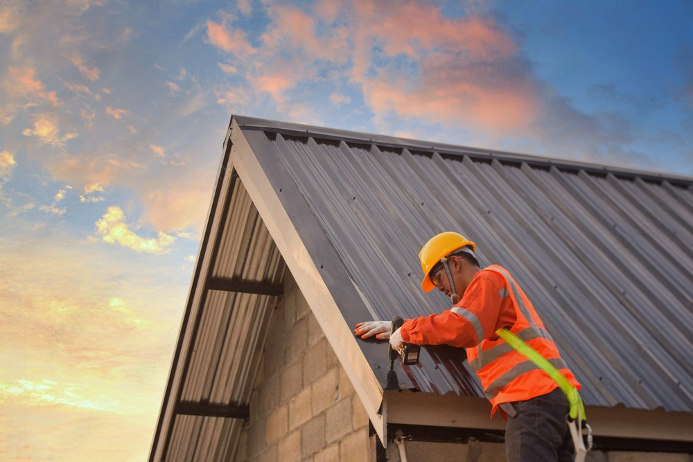 a man wearing a hard hat is working on a roof