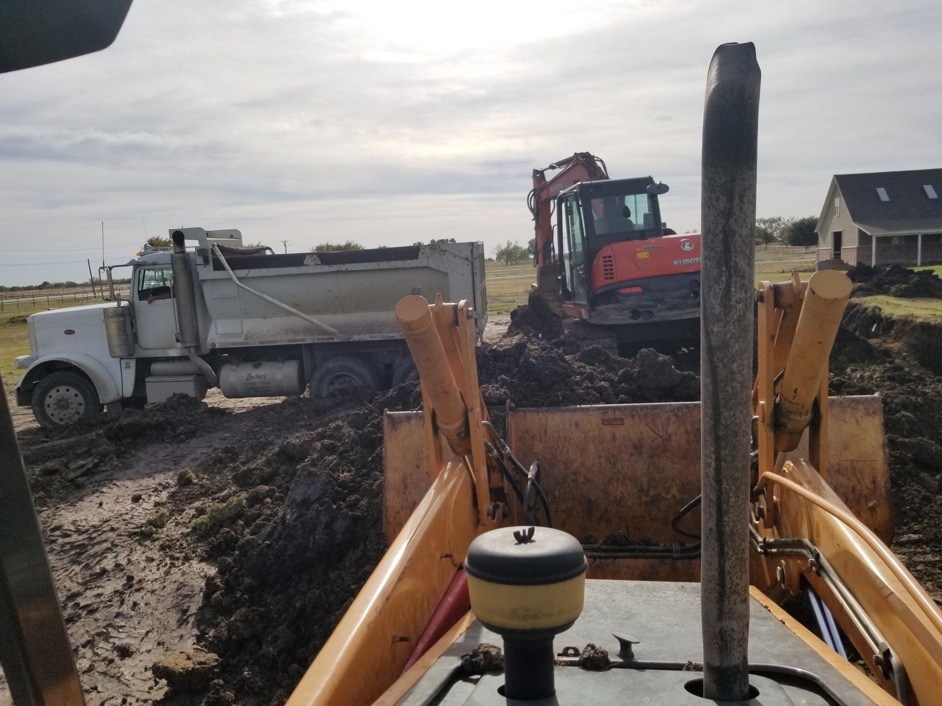 Excavator and Trucks - Dallas, TX - All Around Septic Service Co