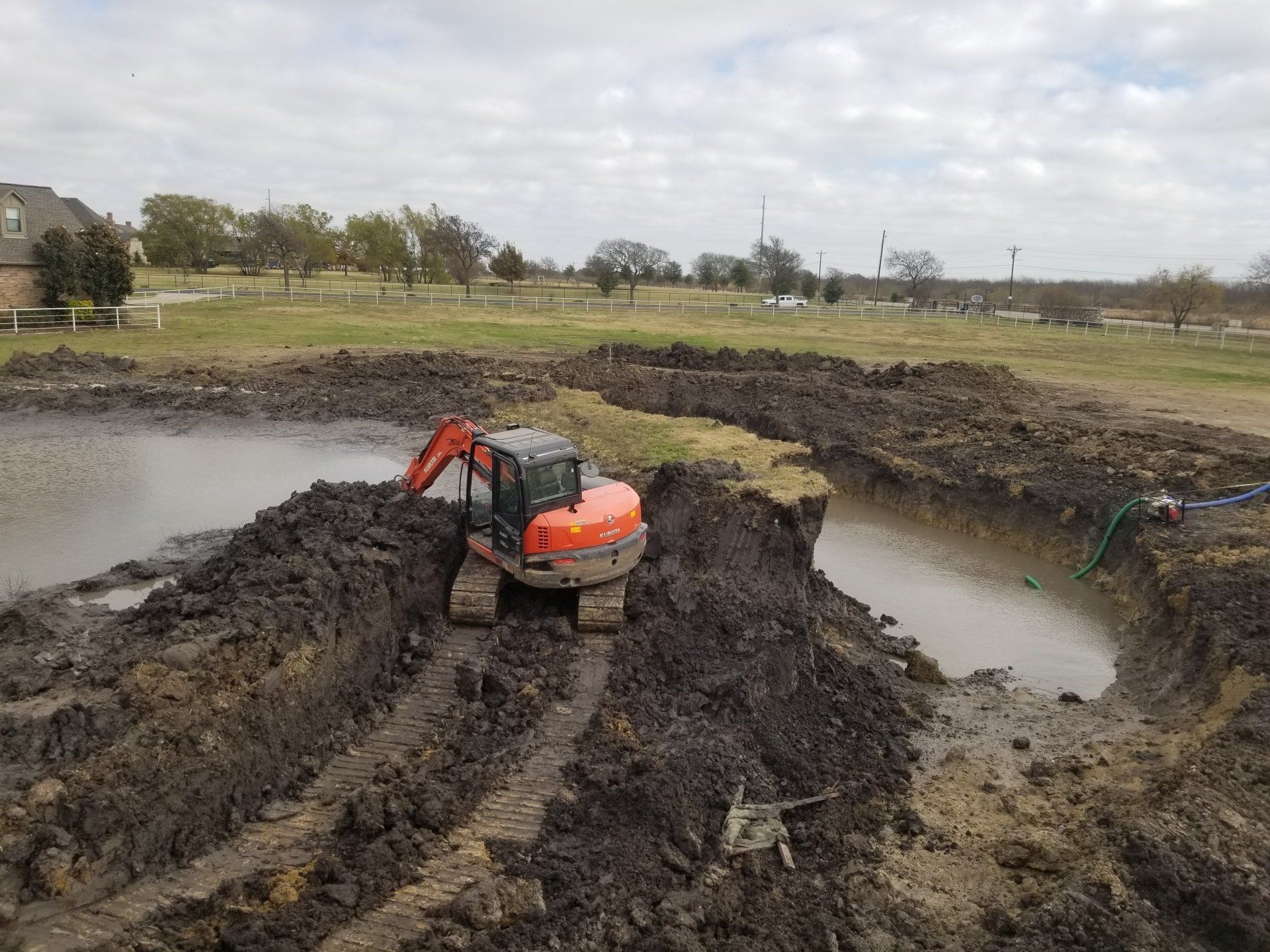 Excavator Truck in the Dirt - Dallas, TX - All Around Septic Service Co