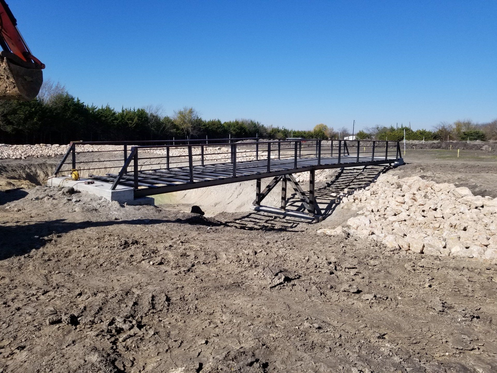 Installing Metal Frame for the Bridge - Dallas, TX - All Around Septic Service Co
