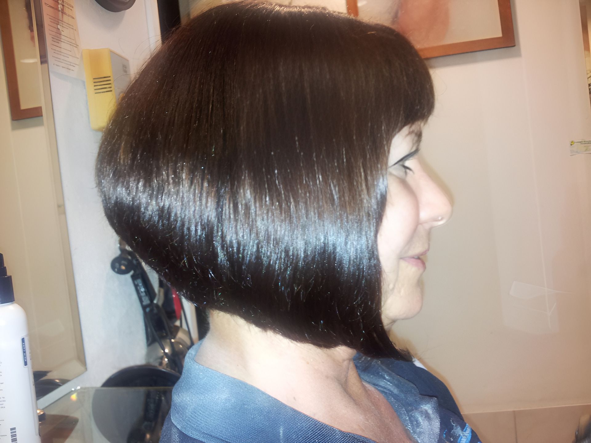 A Woman With A Bob Hairstyle Is Sitting In A Chair — Spiroll Heated Rollers in Redlynch, QLD