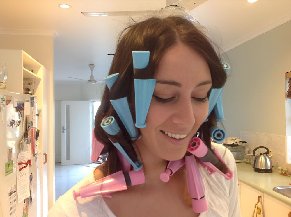 A Woman Is Wearing Pink And Blue Curlers In Her Hair — Spiroll Heated Rollers in Redlynch, QLD