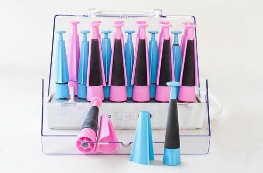 A Woman Is Wearing Pink And Blue Curlers In Her Hair — Spiroll Heated Rollers in Redlynch, QLD