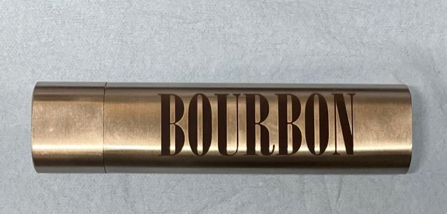 A metal tube with the word bourbon written on it