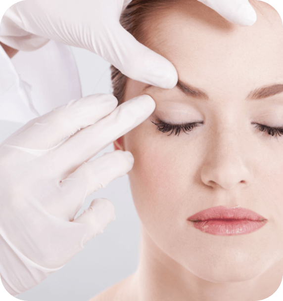 A woman with her eyes closed is being examined by a doctor