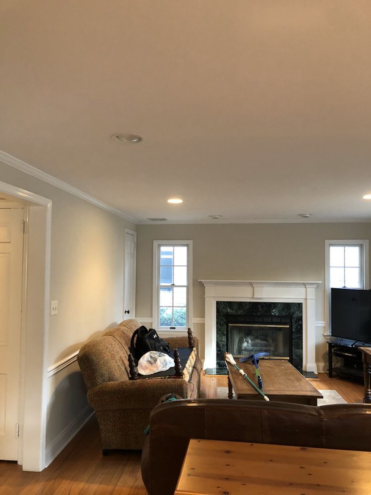 A living room with a fireplace and a couch