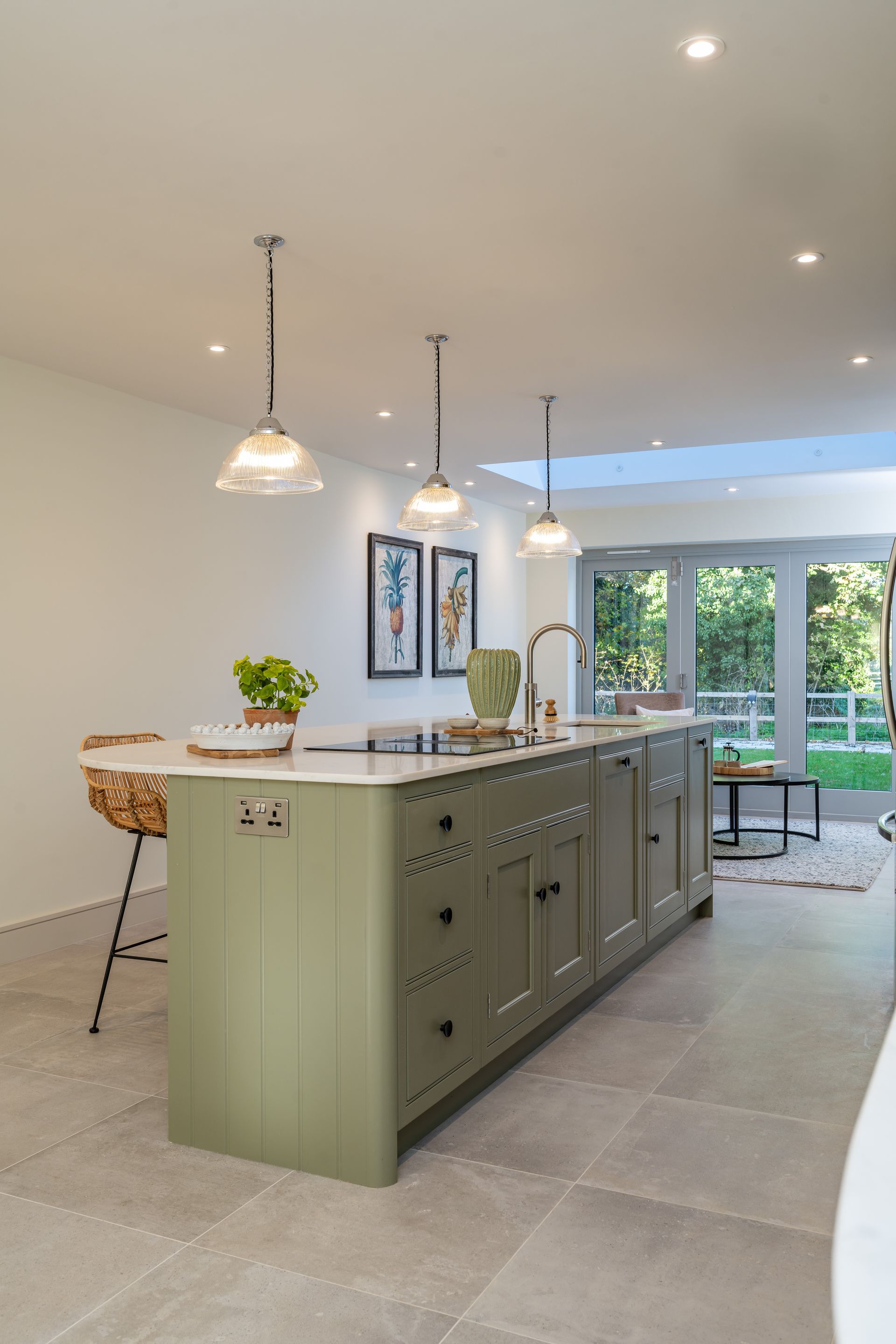 A kitchen with a large island in the middle of the room.