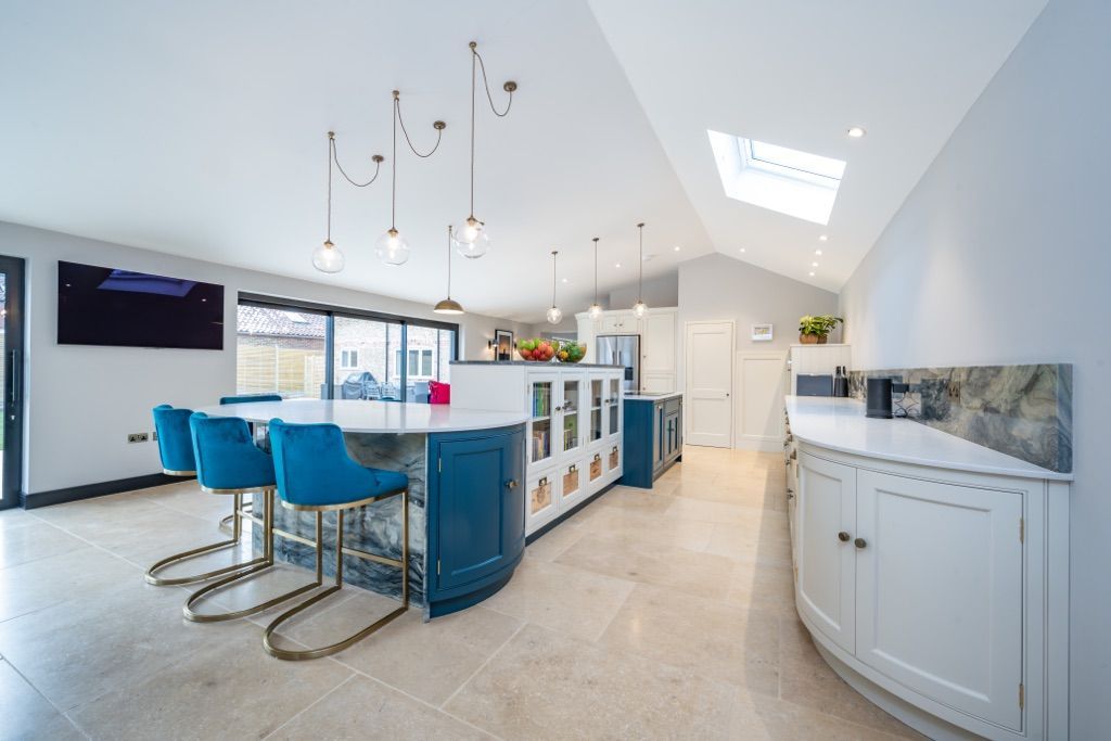 There is a large island in the middle of the kitchen.