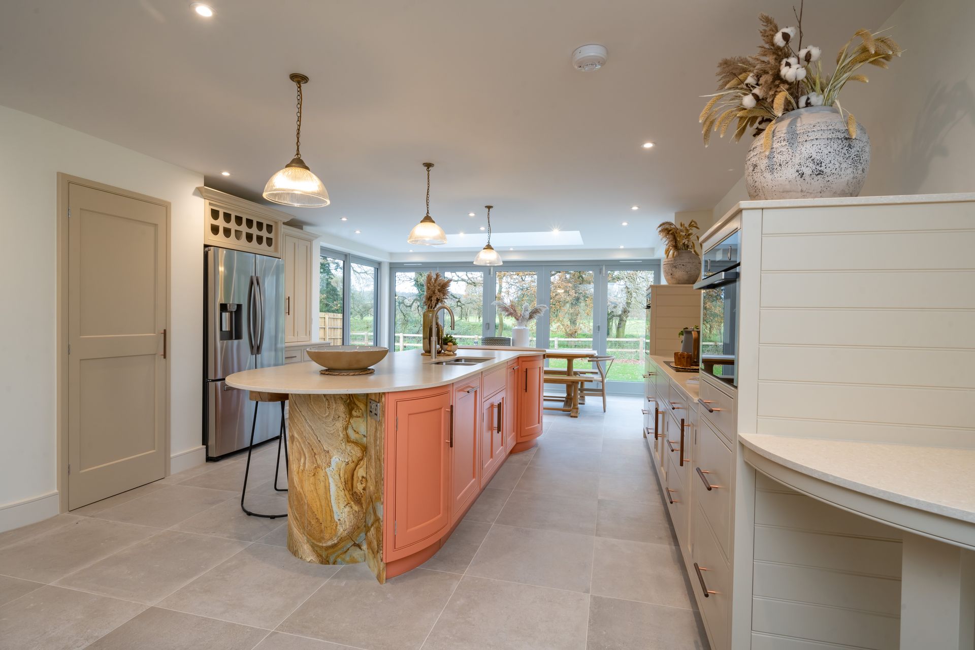 A kitchen with a large island in the middle of the room.