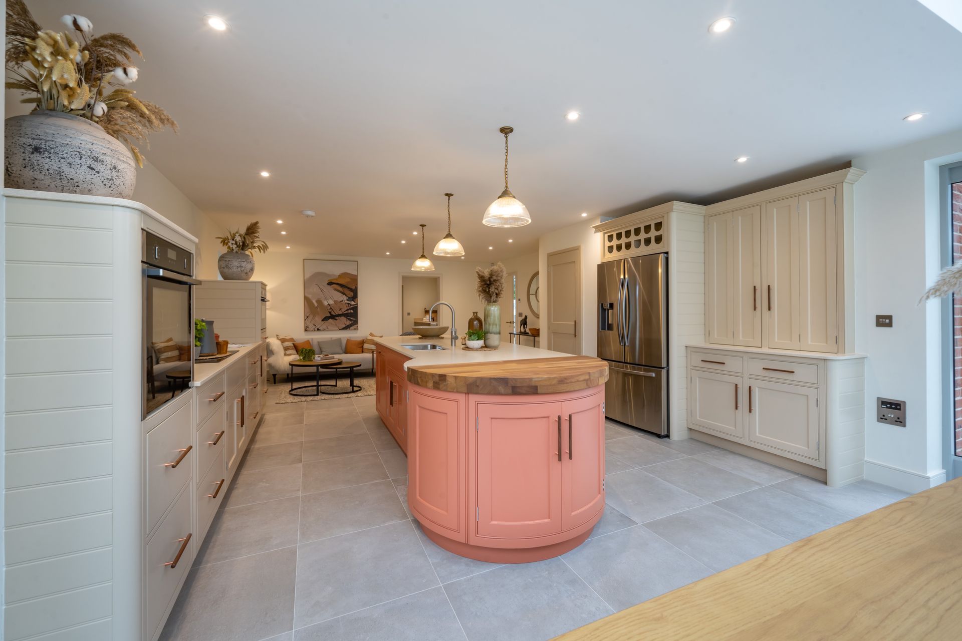 There is a large island in the middle of the kitchen.