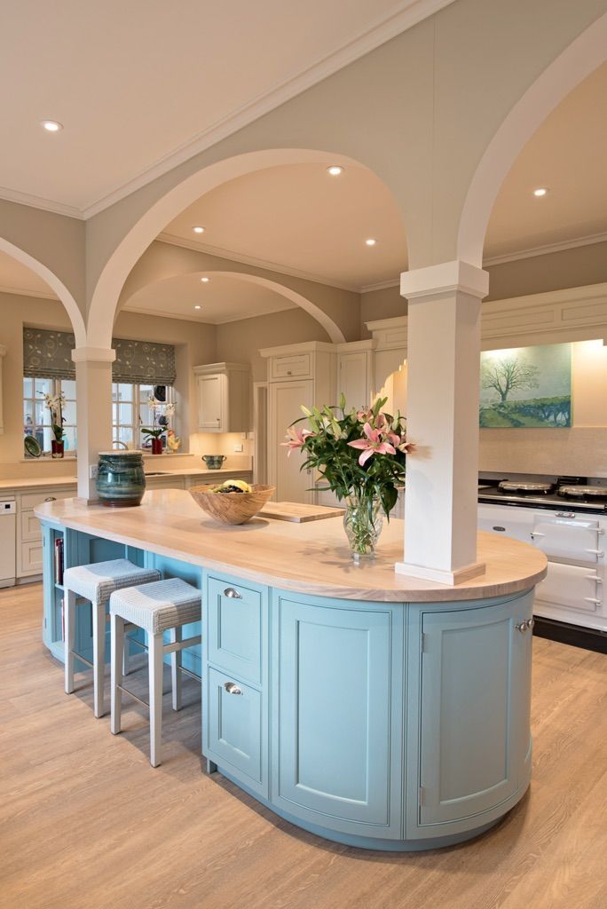 There is a large island in the middle of the kitchen.