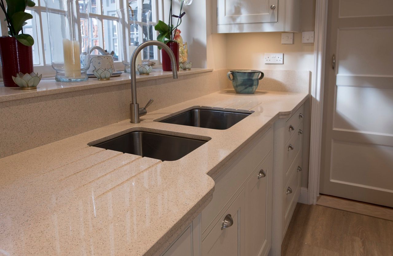 A kitchen with two sinks and a window.