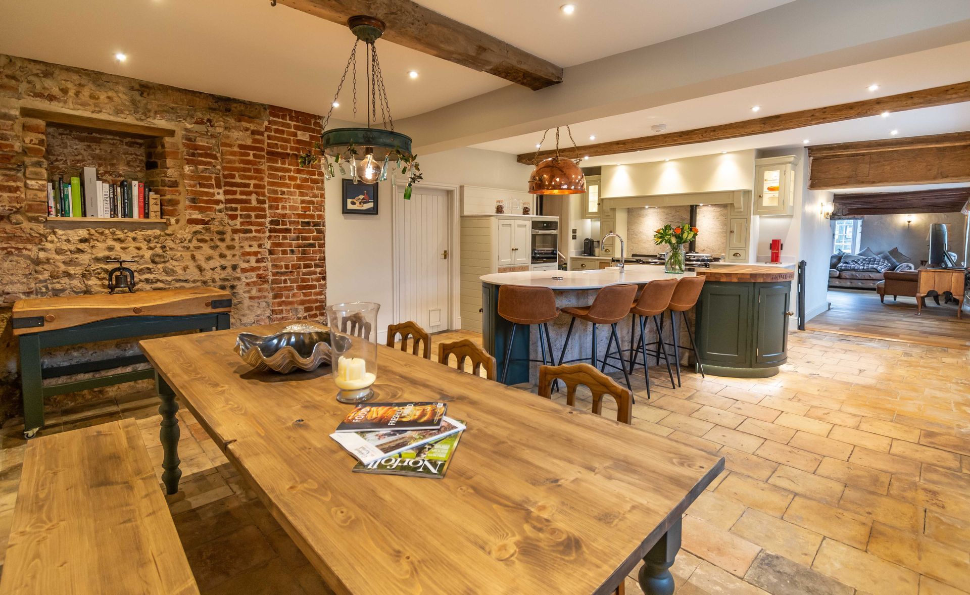 There is a large wooden table in the middle of the room.