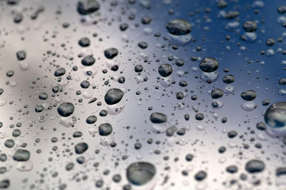 A close up of water drops on a window.