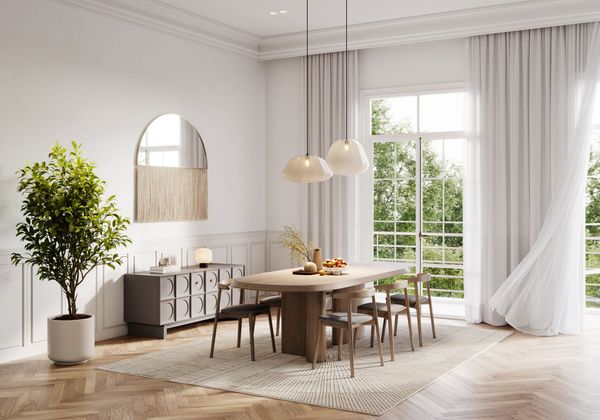 Dining room with wooden table, chairs, and large window with white curtains.