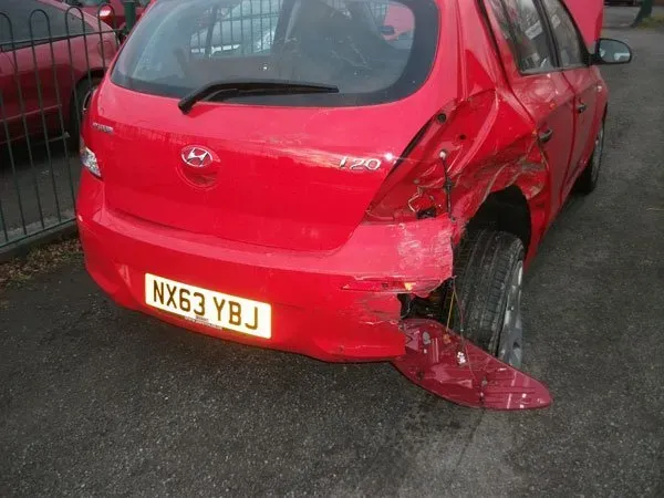 red car bumper repair