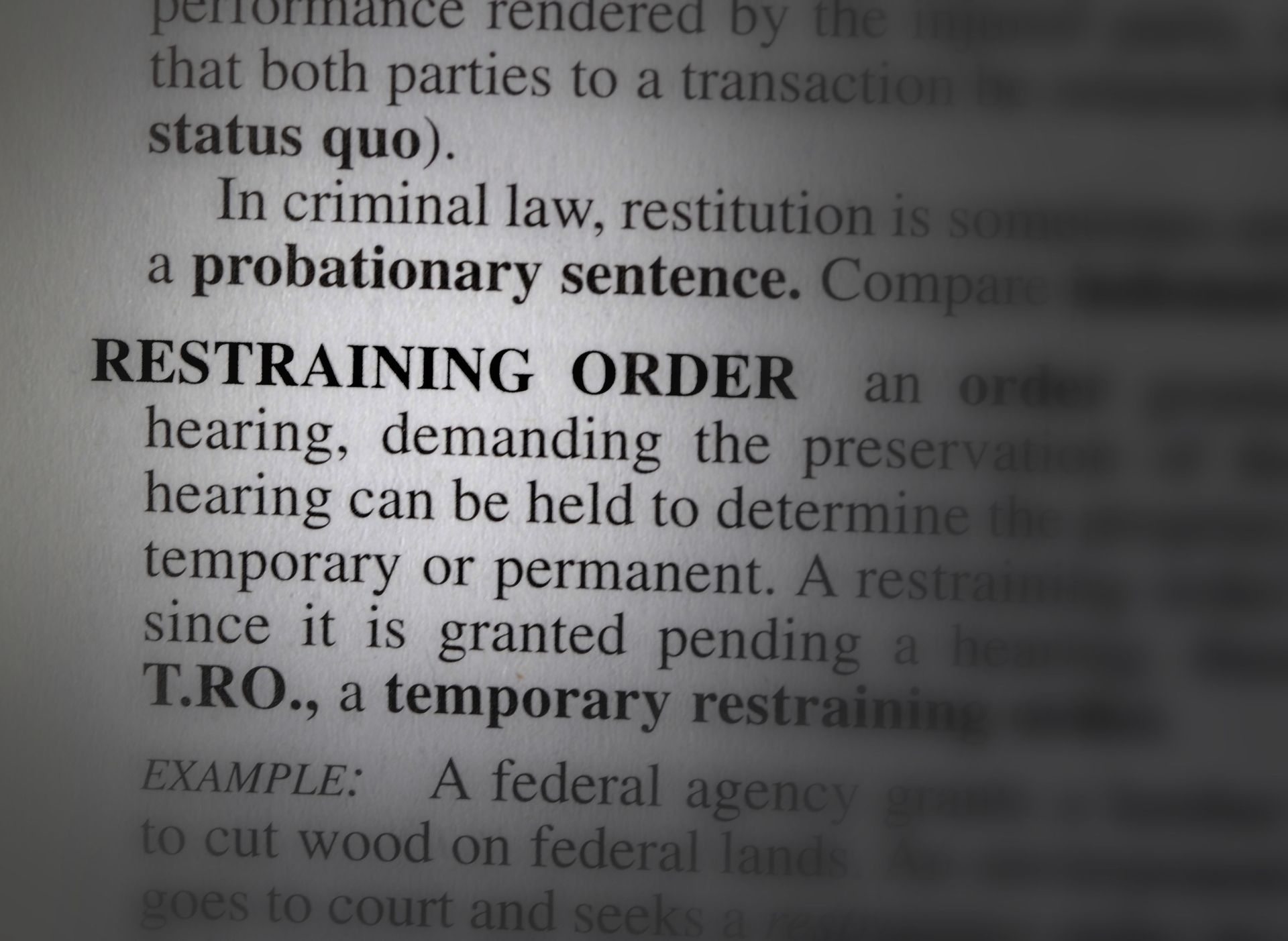 Close-up of a law book, highlighting the definition of 