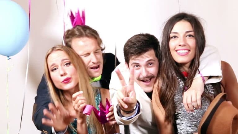 A group of people are posing for a picture at a party.