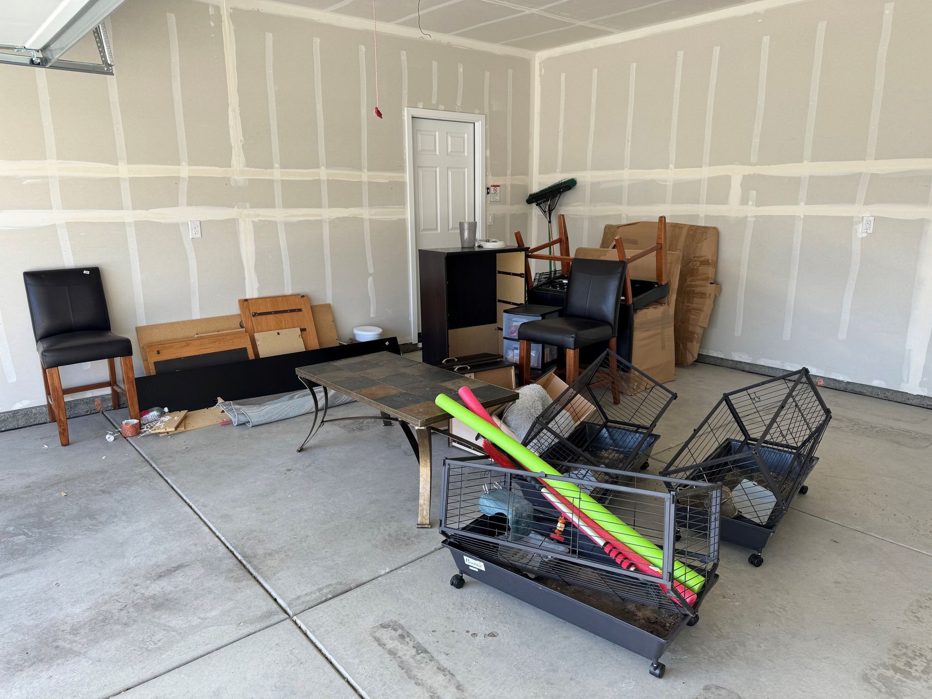 A garage filled with lots of furniture and boxes.