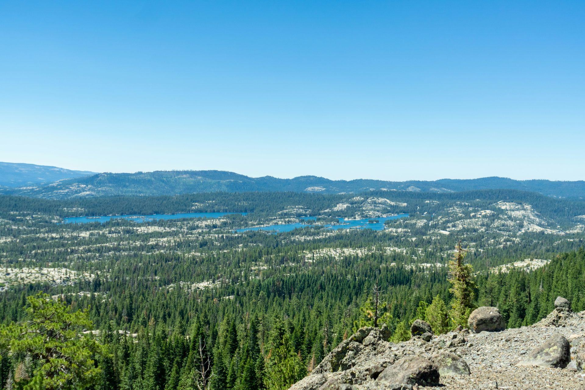 A view of a city from the top of a mountain.
