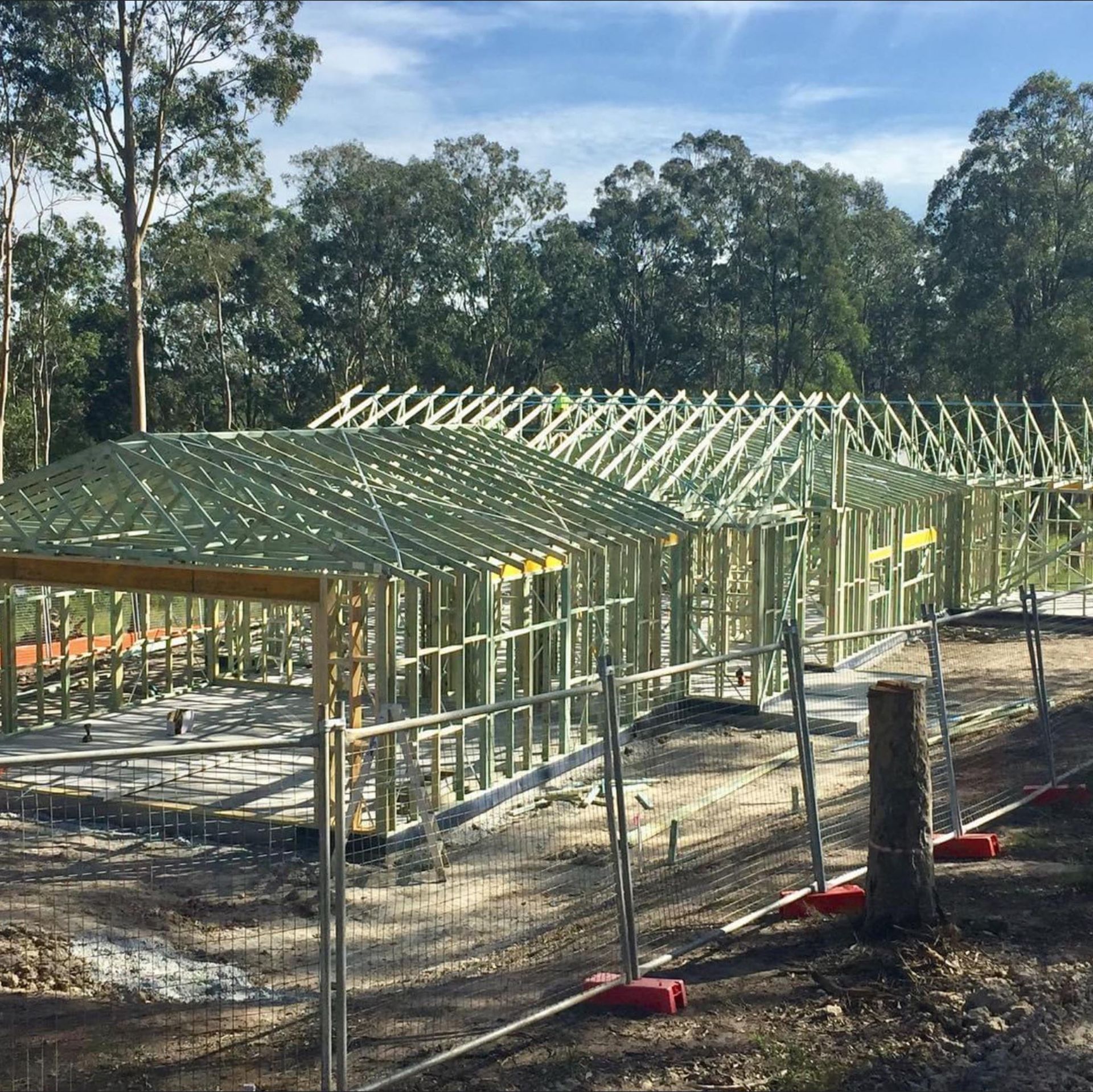 Construction Site With Wooden Frames for a Building — McNamara's Frames & Trusses In Coffs Harbour, NSW