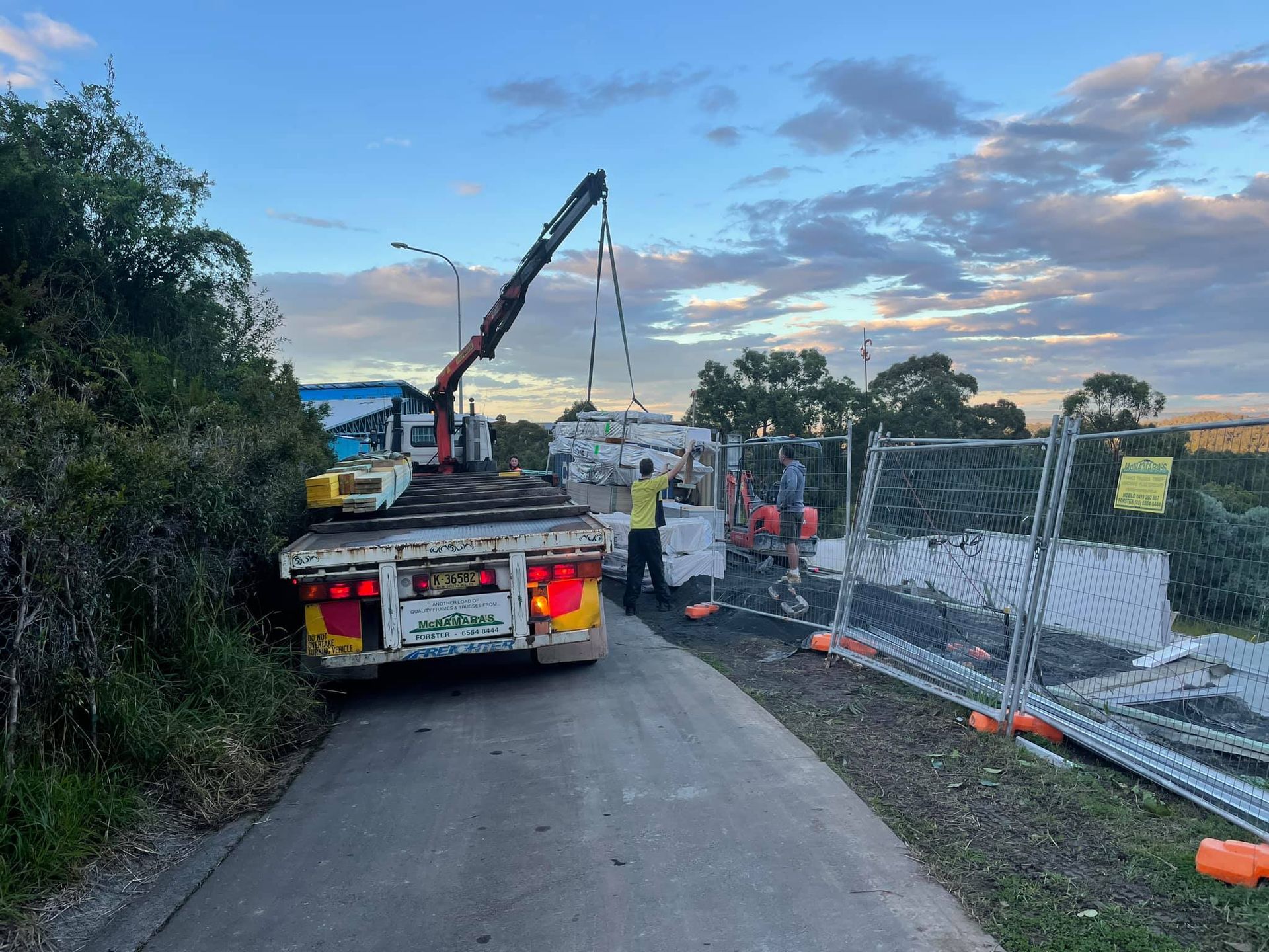 Truck With Crane Lifting Object — McNamara's Frames & Trusses In Forster, NSW