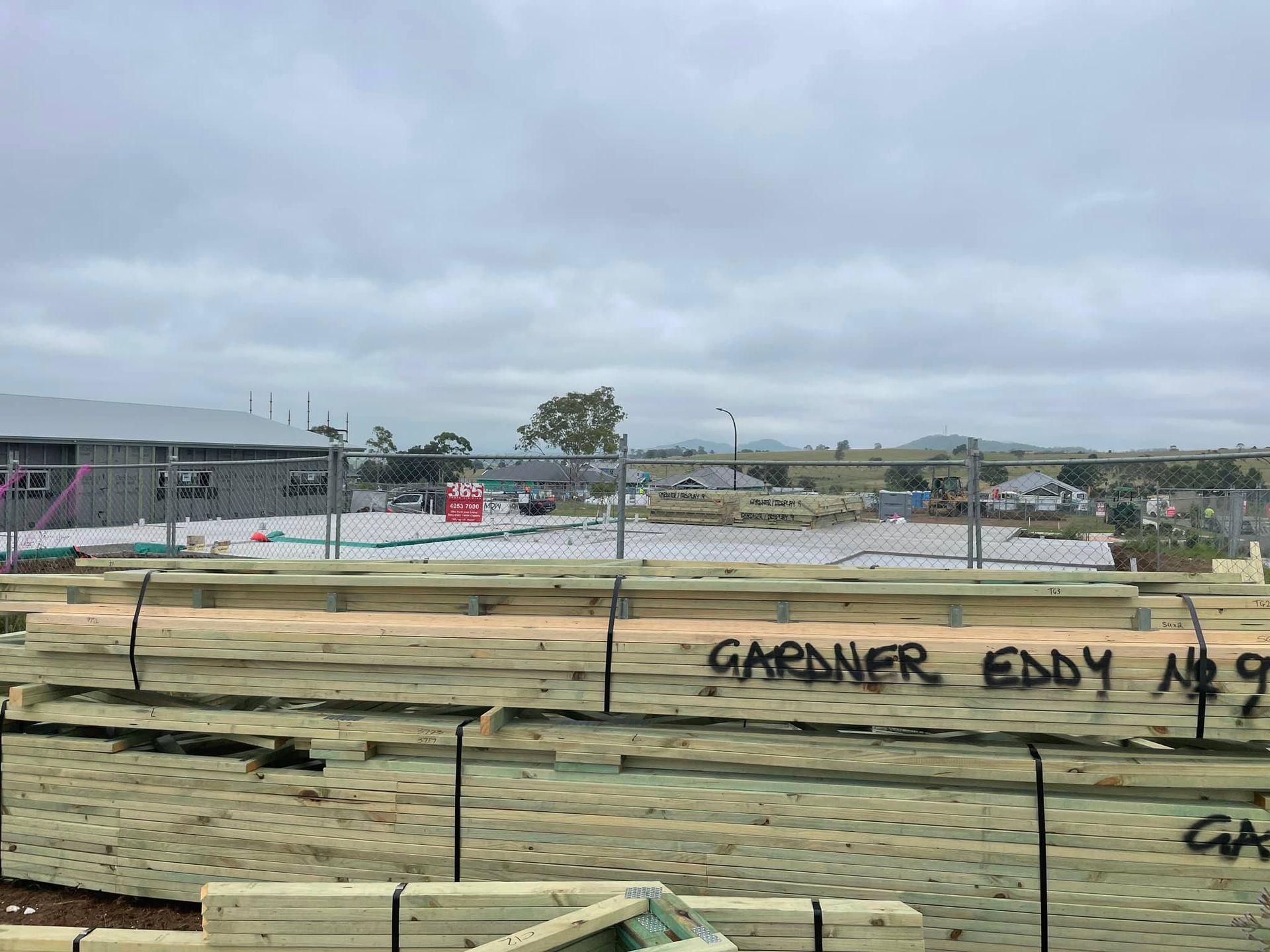 Stacks of Timber on a Construction Site — McNamara's Frames & Trusses In Kempsey, NSW