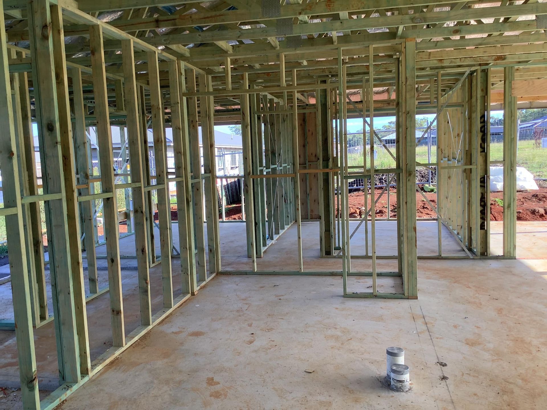 Wooden Frame of a House Under Construction; Green Lumber — McNamara's Frames & Trusses In Newcastle, NSW