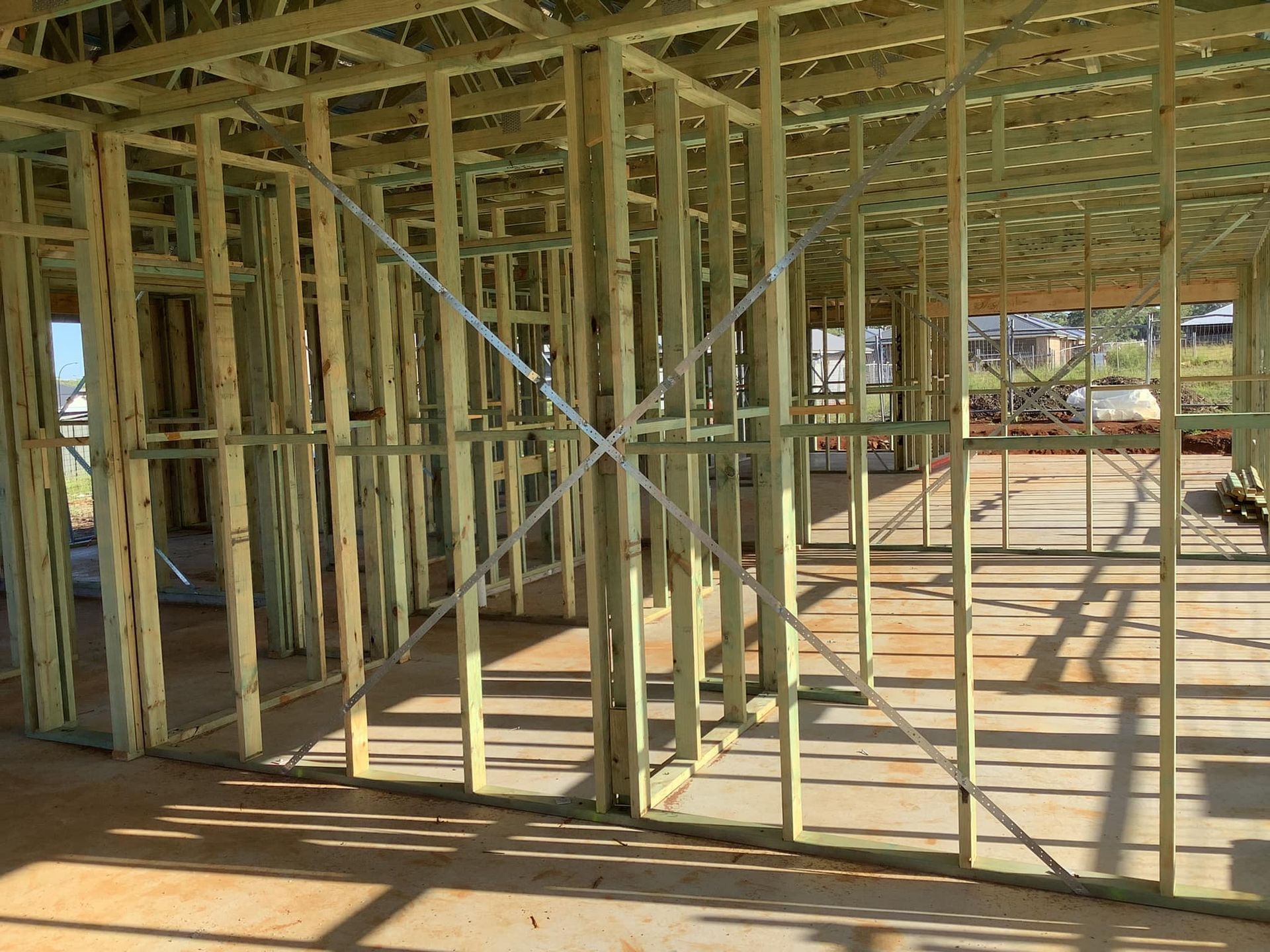 Wooden Frame of a Building Under Construction — McNamara's Frames & Trusses In Port Stephens, NSW