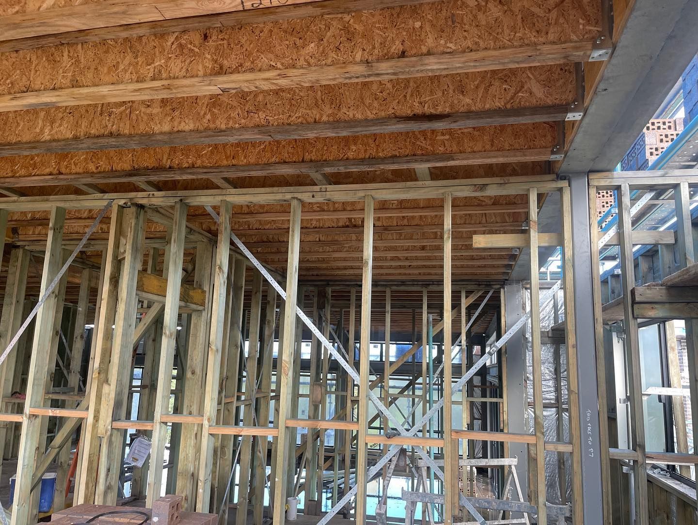Interior view of a building under construction, showing wooden framing — McNamara's Frames & Trusses In Tuncurry, NSW