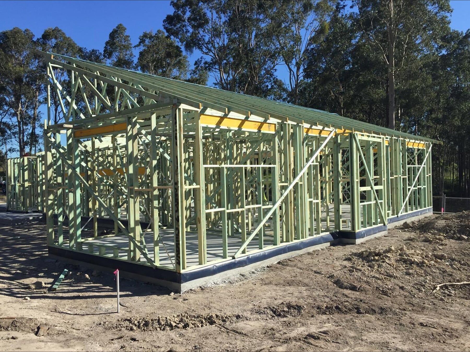 A Wooden Frame Structure of a House Under Construction — McNamara's Frames & Trusses In Forster, NSW