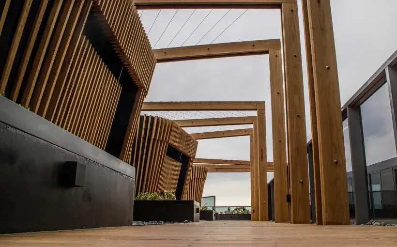 Wooden Pergola and Benches on a Rooftop Terrace — McNamara's Frames & Trusses In Forster, NSW