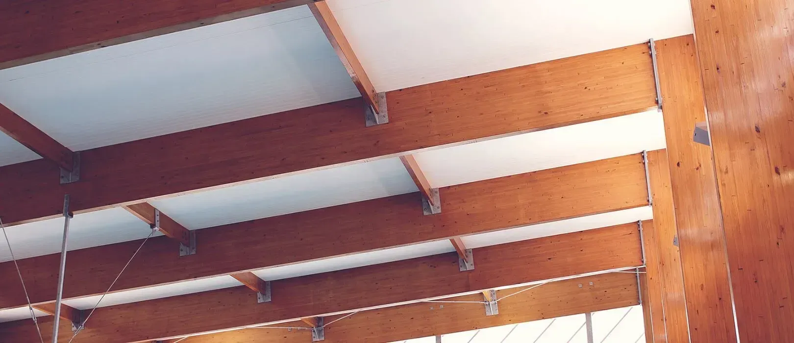 Wooden Beams and White Panels Form a Ceiling — McNamara's Frames & Trusses In Forster, NSW