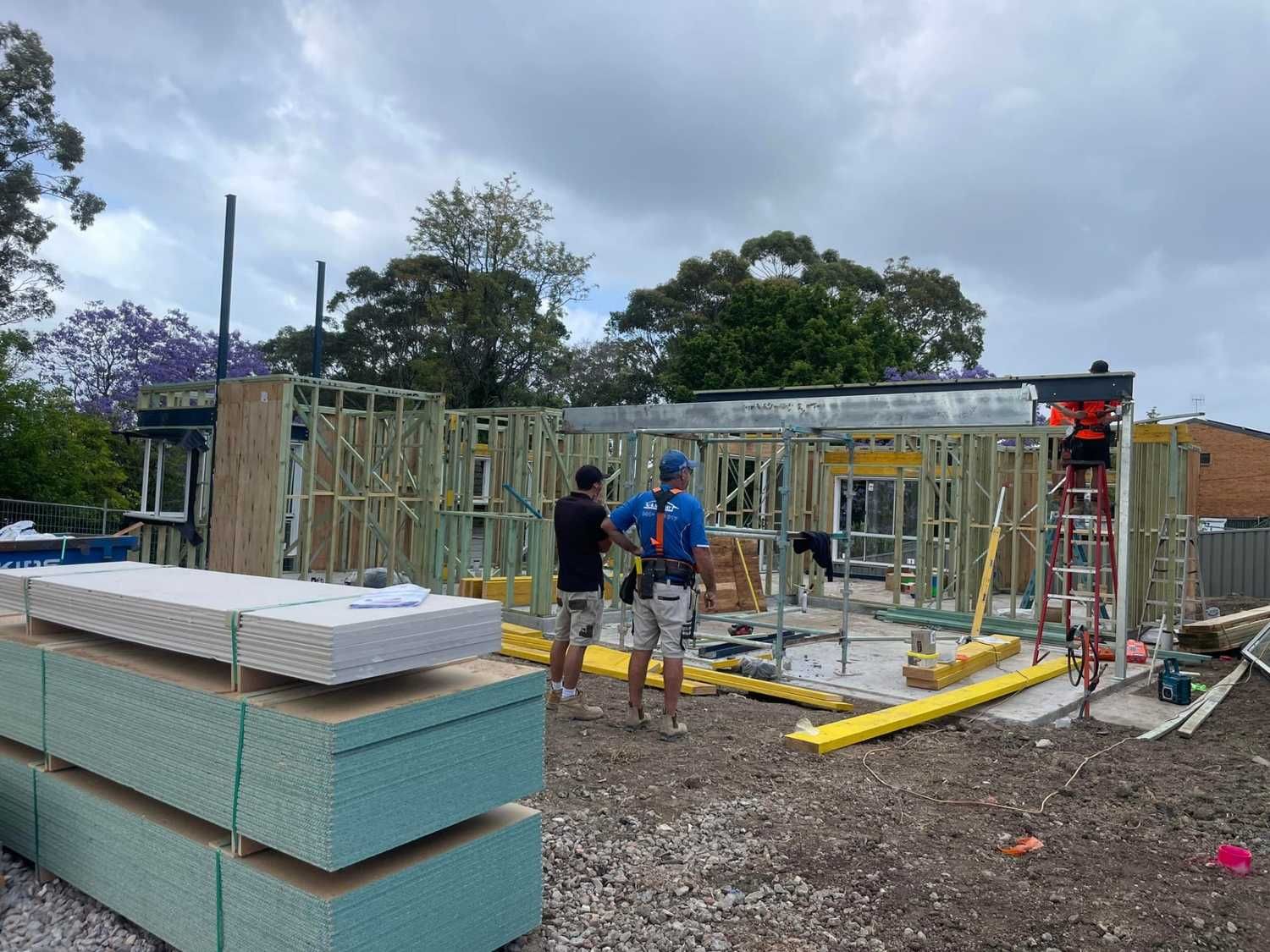 Construction of a Wooden-framed Building With Workers Present — McNamara's Frames & Trusses In Mid North Coast, NSW