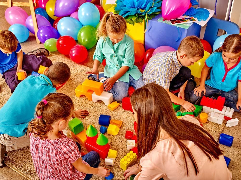 Group Children Game Blocks And Balloons On Floor