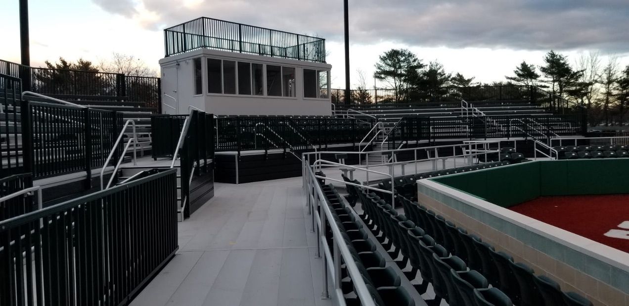 Baseball stadium with spectator seating, a press box, and a view of the field.
