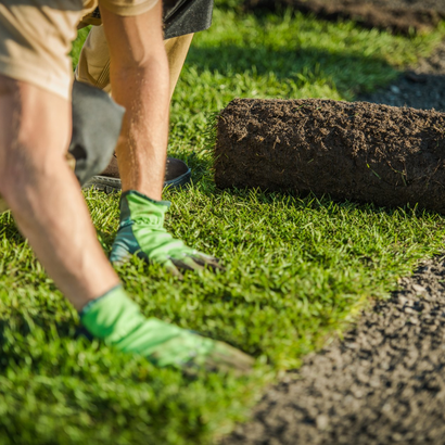 Professional landscaper lay natural grass turfs — Harrisburg, PA — Green River Landscaping
