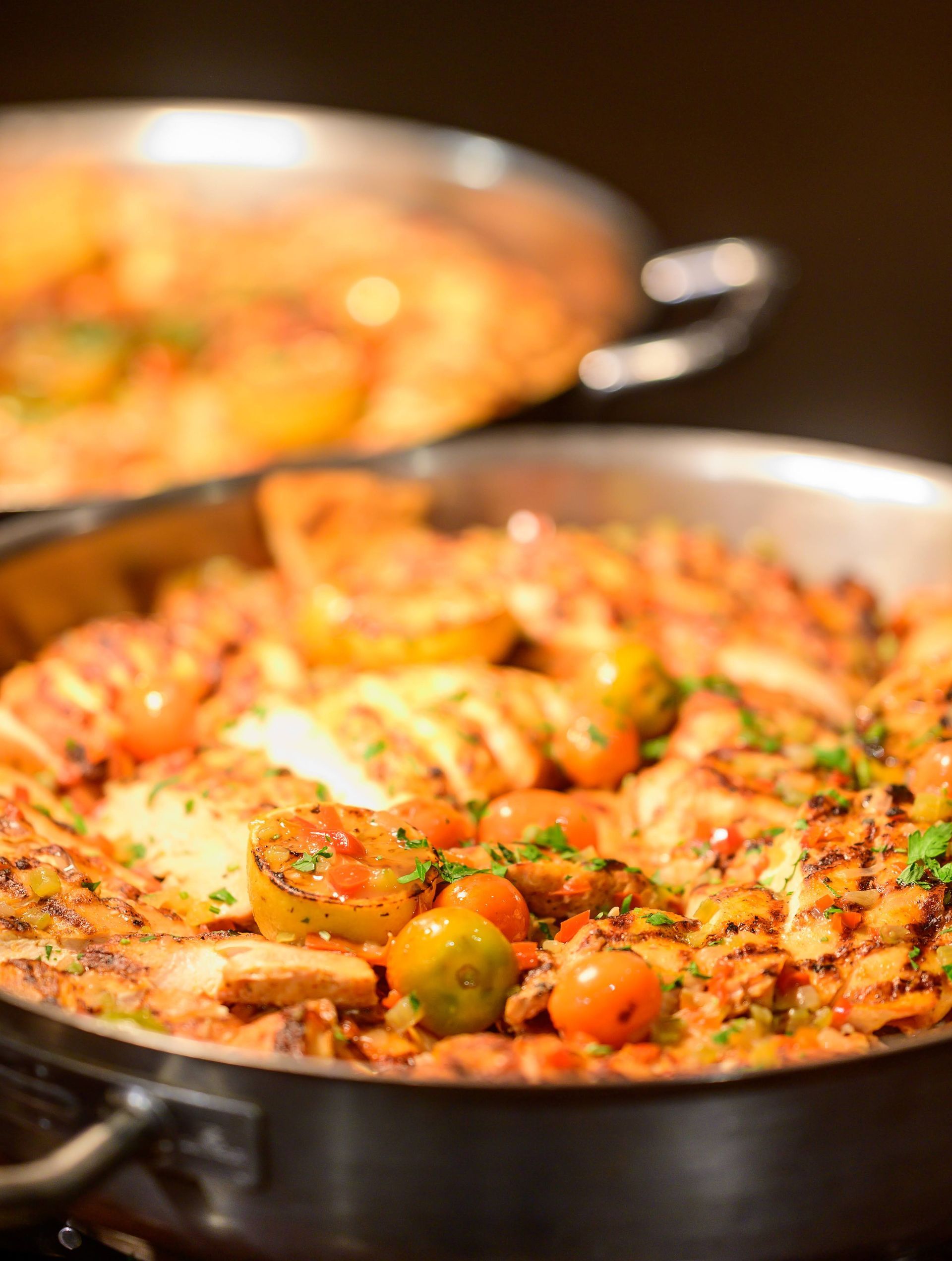 A pan filled with food is sitting on a table.