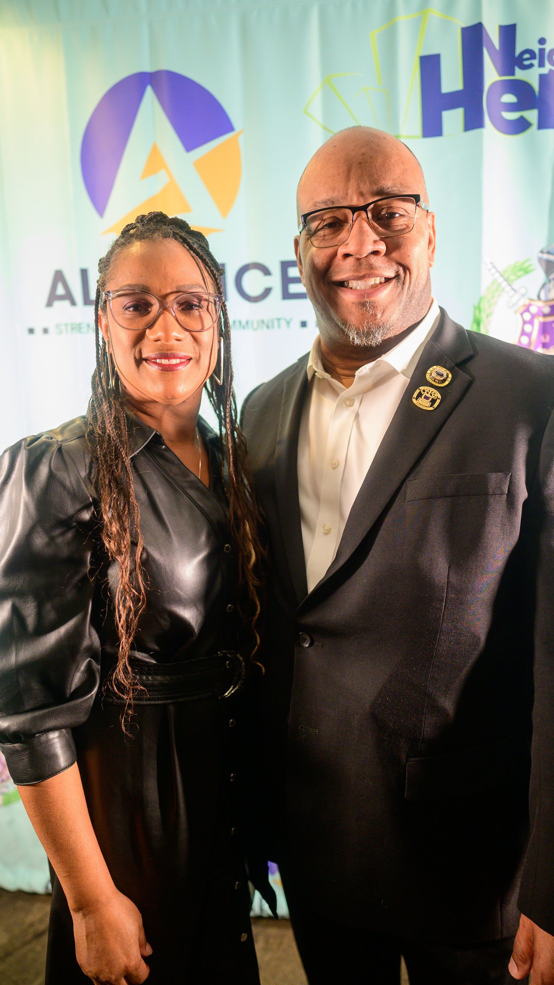 A man and a woman are posing for a picture together.