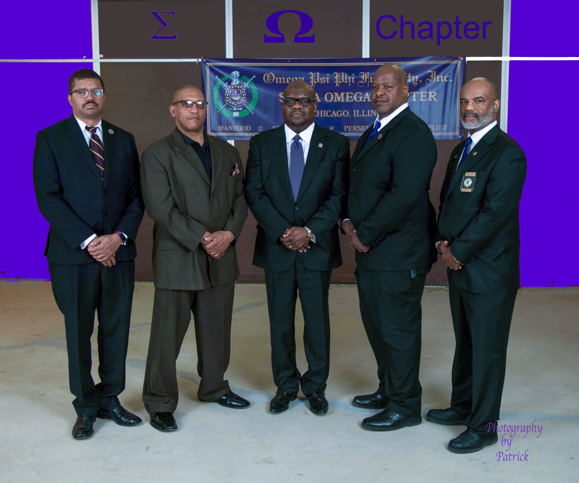 A group of men standing in front of a sign that says chapter