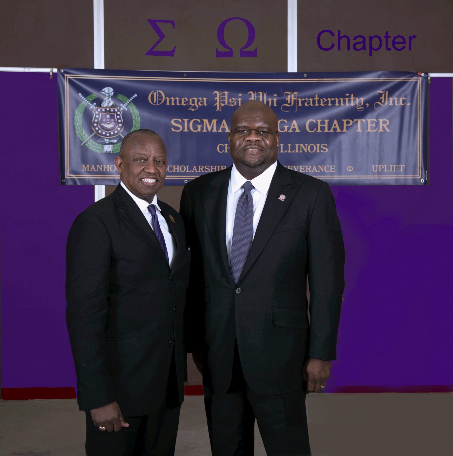 Two men standing in front of a banner that says chapter