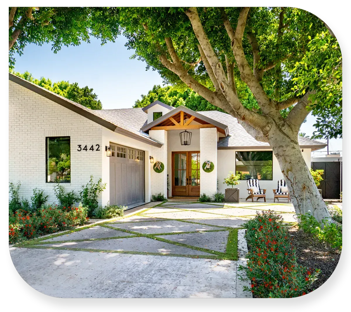 Residential home with properly trimmed and maintained trees Residential home with properly trimmed and maintained trees