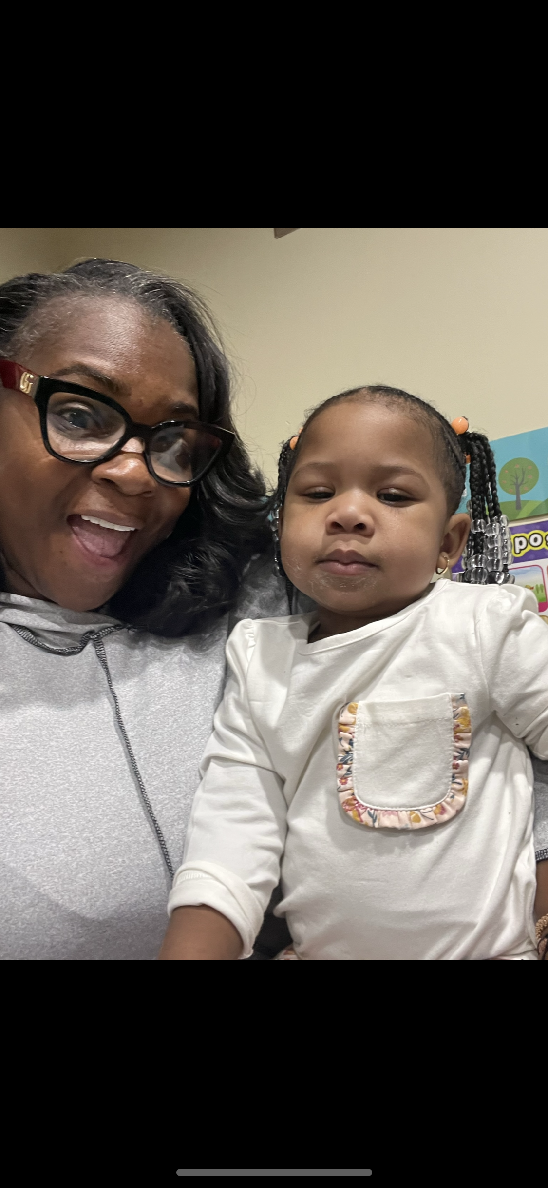 A boy and a girl are playing in a library.