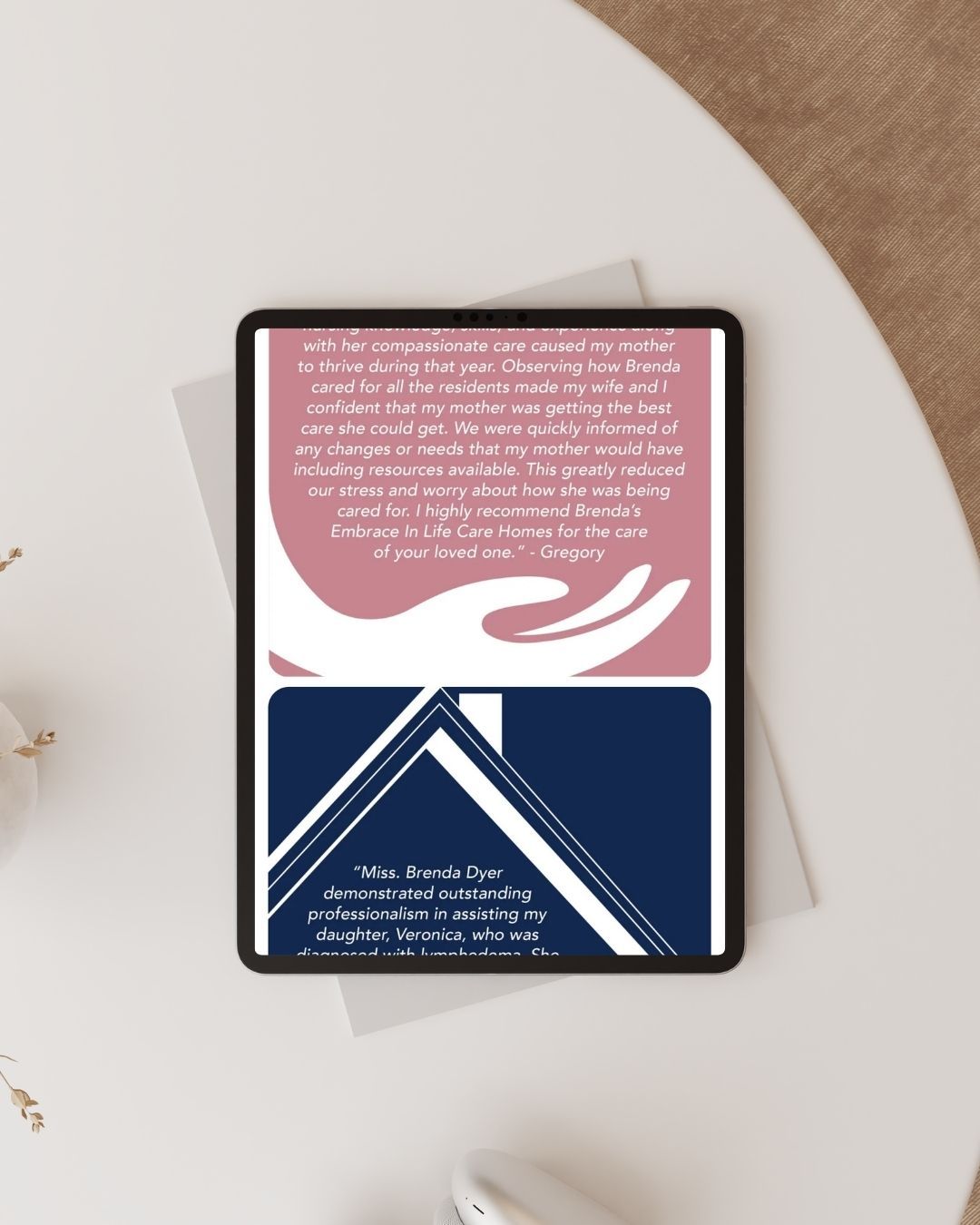 A tablet is sitting on top of a white table.