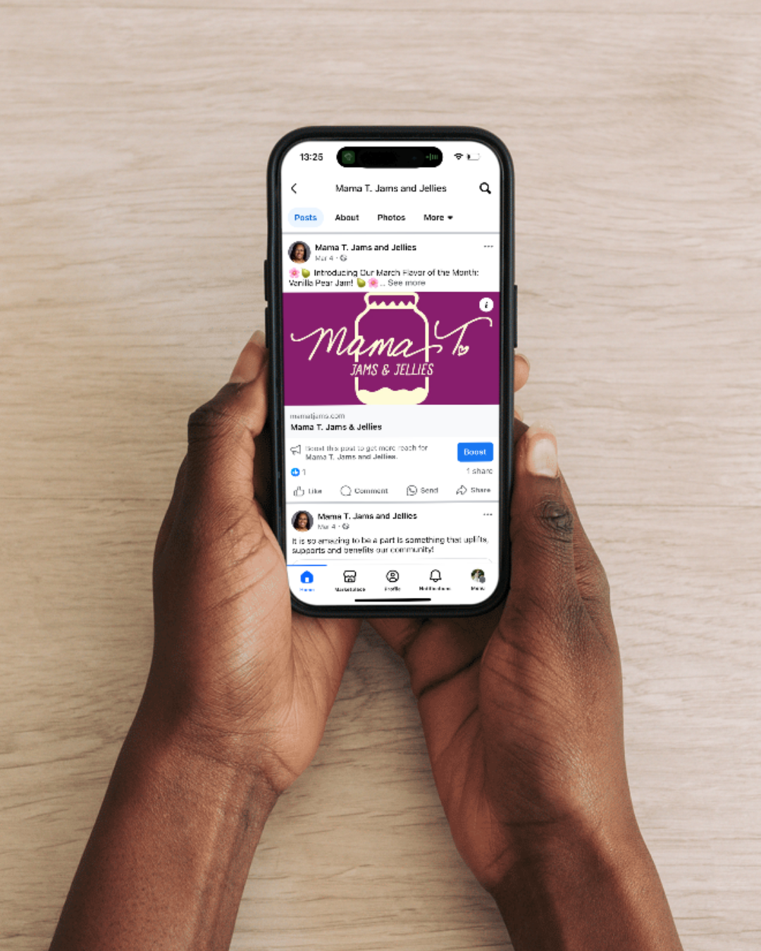 A person is holding a cell phone in their hands.