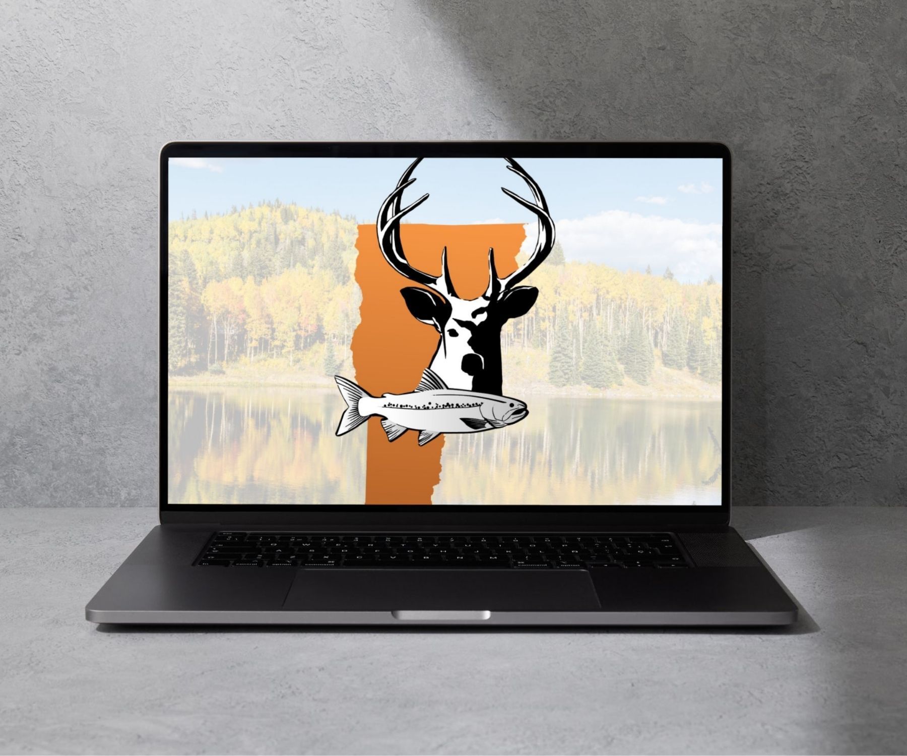 A laptop with a picture of a deer and a fish on the screen
